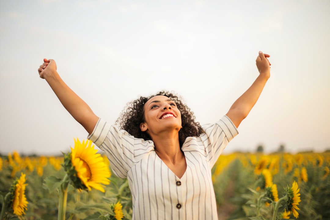 photo-of-woman-standing-on-sunflower-field-3756168