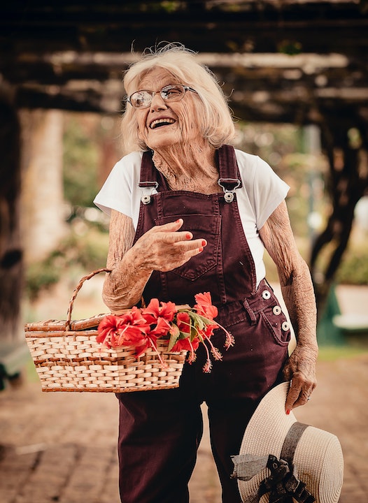 woman-wearing-brown-dungaree-pants-holding-sunhat-and-picnic-2050981